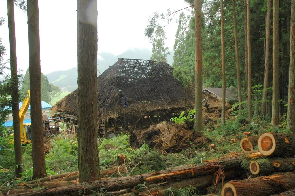 Old farmhouse roof and timber structure exposed during the Hakuba kominka renovation