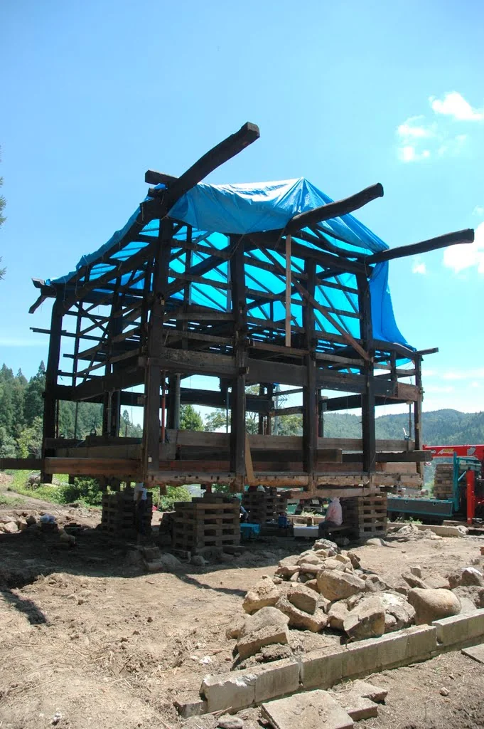 Traditional timber frame of Rental Farmhouse Tamaki standing during structural restoration