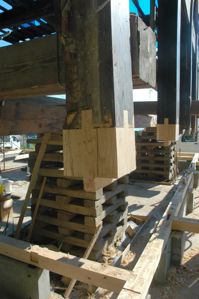 Close view of an old timber post during structural repair of the Hakuba farmhouse