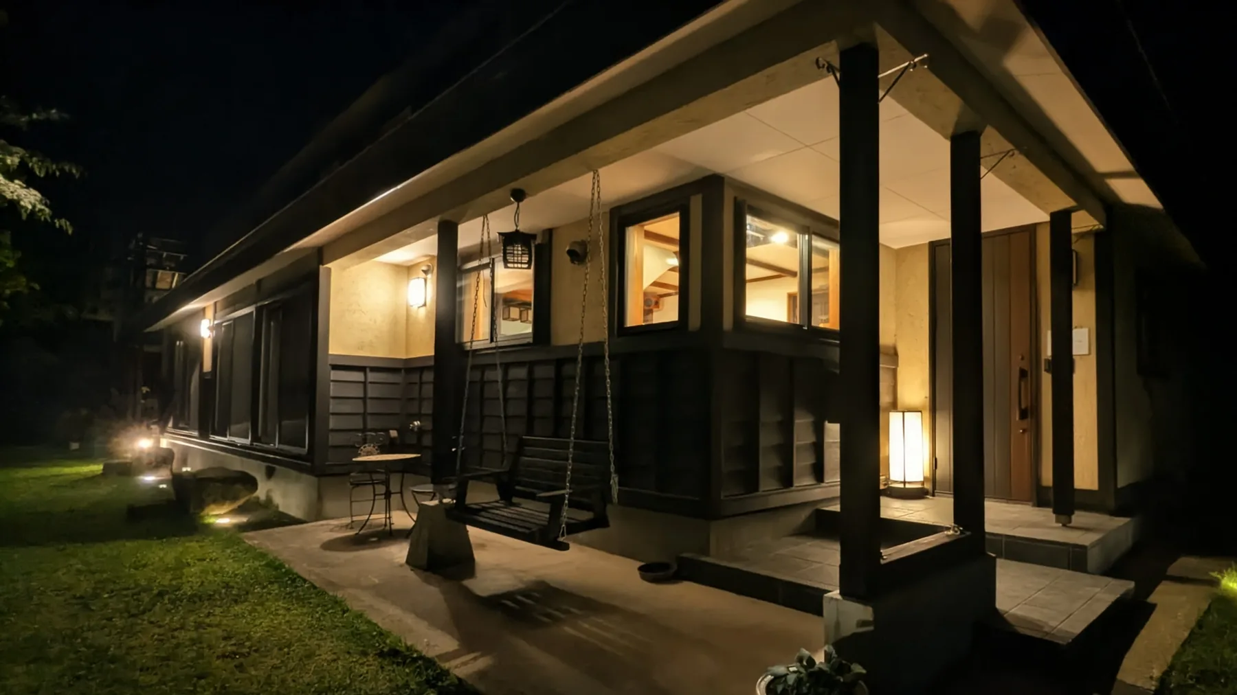 The farmhouse entrance illuminated at night