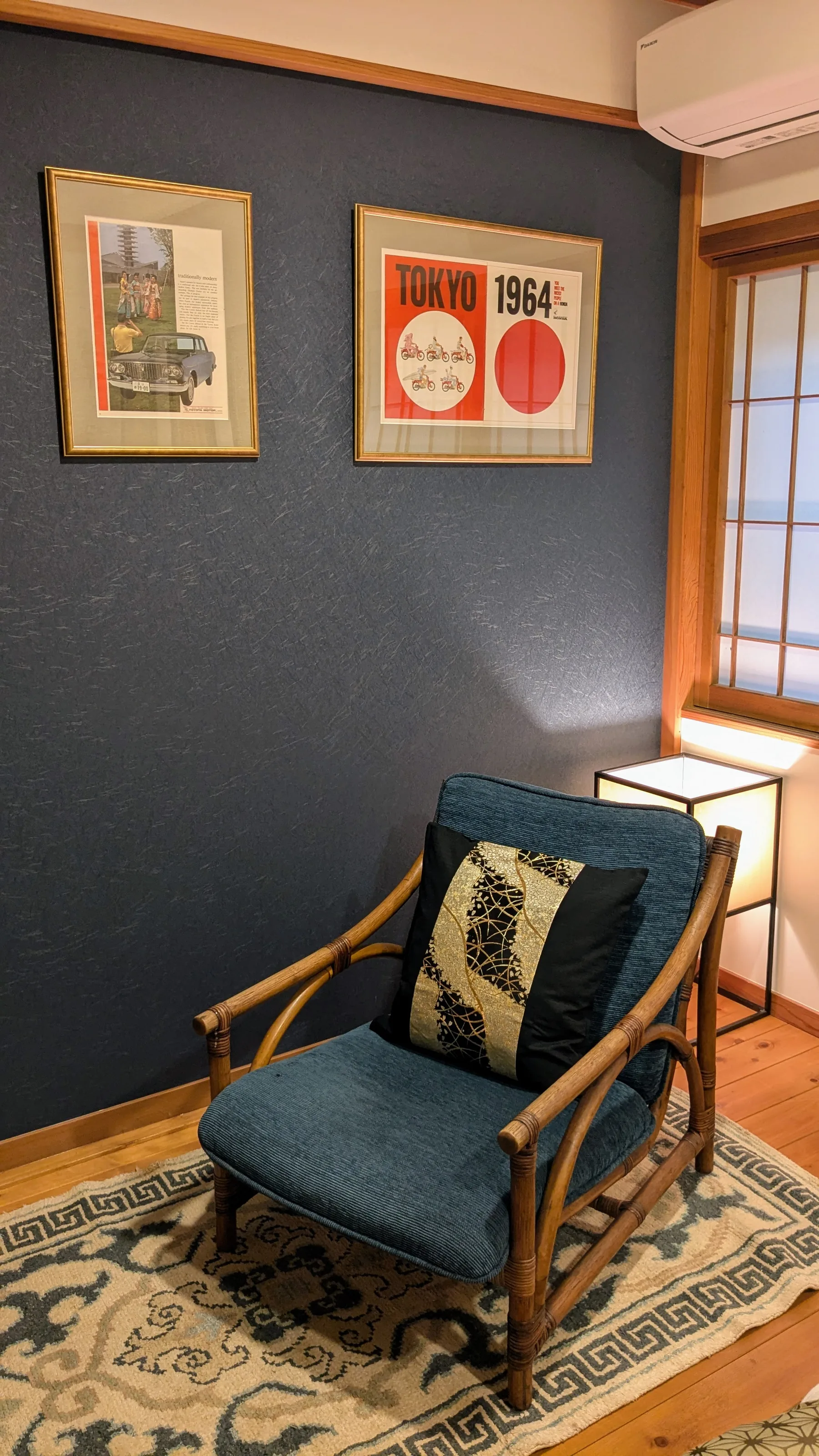 Japanese-style chair and bedside detail in a twin room