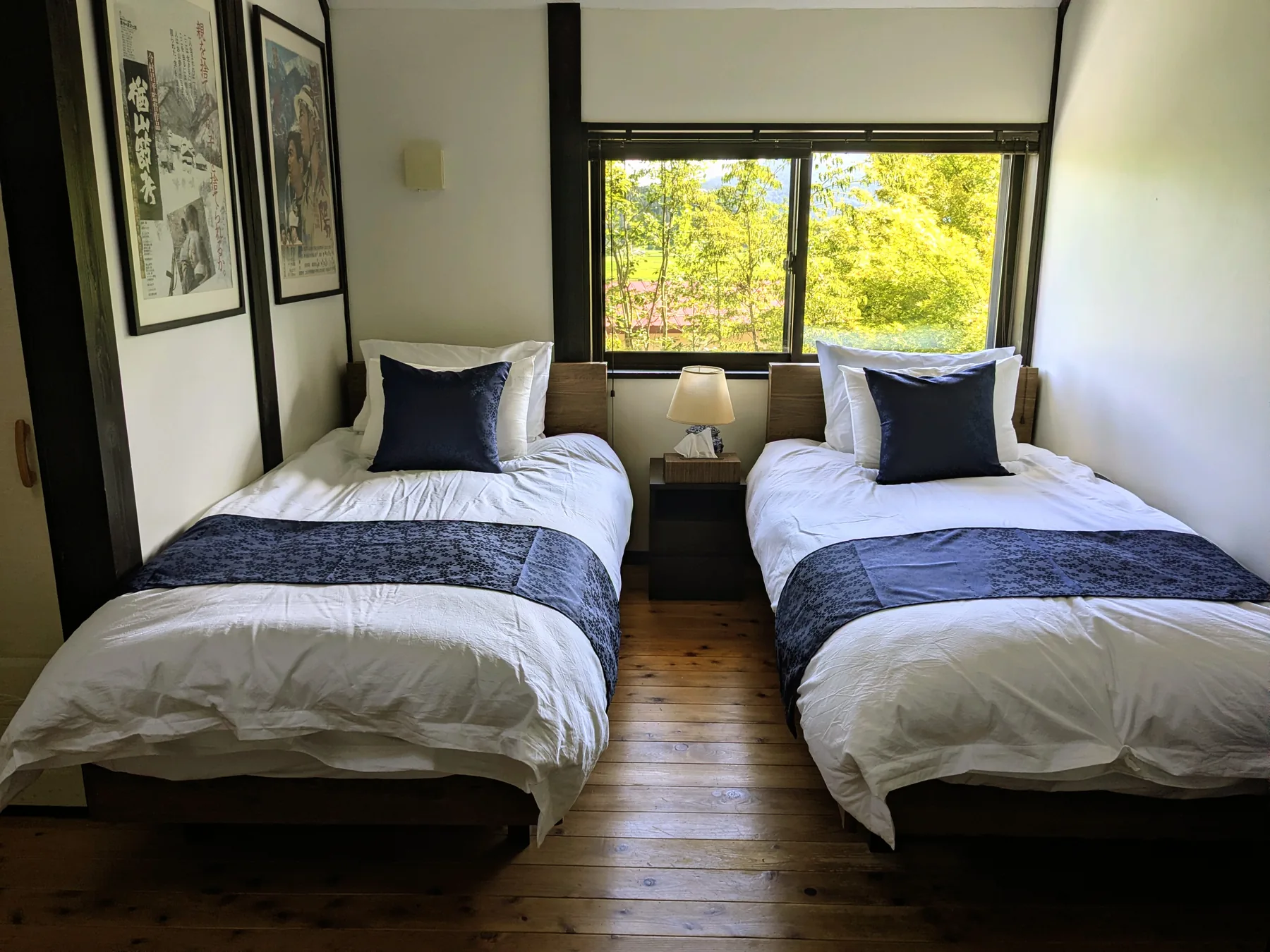 Upstairs twin bedroom overlooking greenery