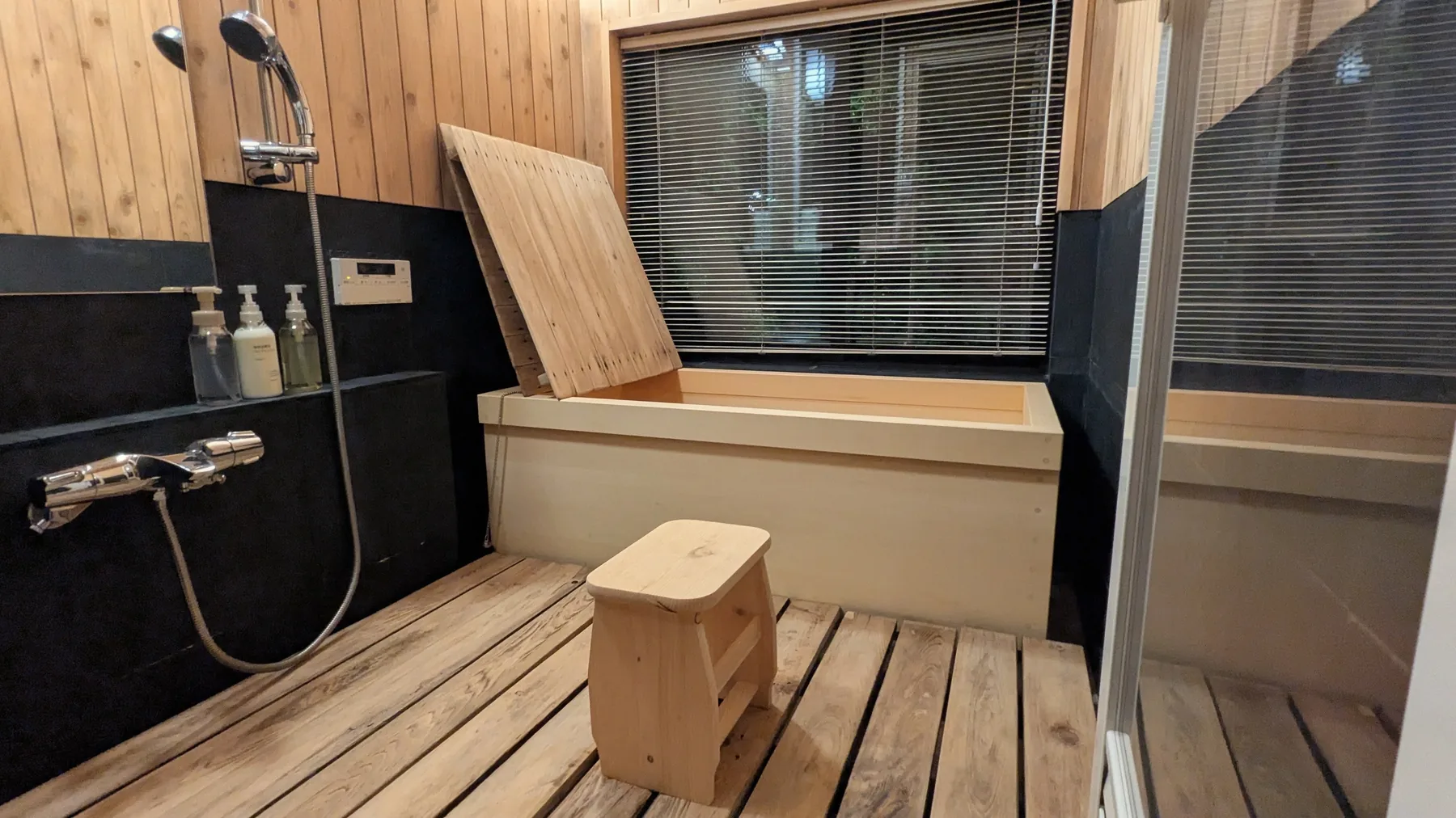 Japanese-style bath area with timber finish